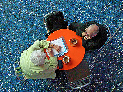 Two people talking across a table