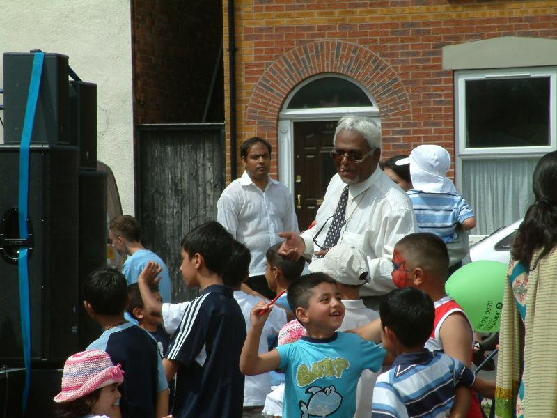 A family with all the generations having a party outside