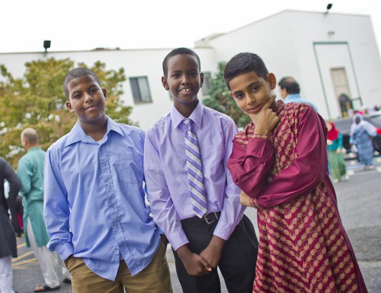 Three young boys posing and looking cheeky